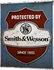 Табличка металлическая 30х40см "Smith & Wesson / Protected by" (арт.202) ― STARINISM.RU